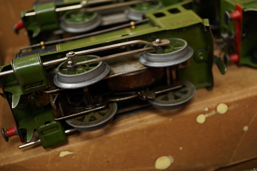 A collection of Hornby clockwork tinplate 0 gauge railway, including; two LNER 0-4-0 tender locomotives, both 1842, (No.501), together with six 4-wheel wagons and coaches, a boxed No.3 Station, level crossing, signal cab